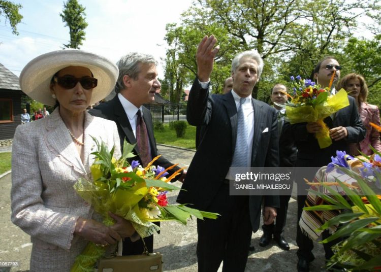 BRAN, ROMANIA:  Dominic of Habsburg (C), a New York architect gestures as he arrives in Bran village, shortly before the handover ceremony of the Bran Castle, known as Dracula Castle, 200km north from Bucharest, 26 May 2006. Dominic of Habsburg is a descendant of the Habsburg dynasty which ruled Romania for a period starting in the late 17th century for more than 60 years. After it was seized by communists, the Romanian government  hands back one of the country's most popular tourist sites, the fabled Dracula Castle, to its former owner. The castle, worth an estimated $25 million, was owned by the late Queen Marie and bequeathed to her daughter Princess Ileana in 1938. It was confiscated by communists in 1948 and fell into disrepair. AFP PHOTO / DANIEL MIHAILESCU  (Photo credit should read DANIEL MIHAILESCU/AFP via Getty Images)